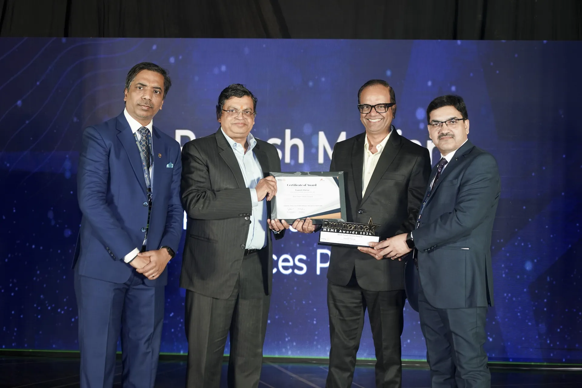 Award presentation on stage at the Eminence MSME Awards