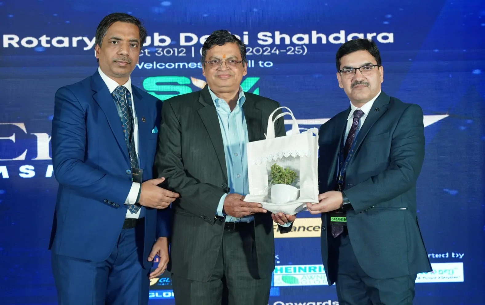 Early Grow representatives with a guest on stage at the Eminence MSME Awards