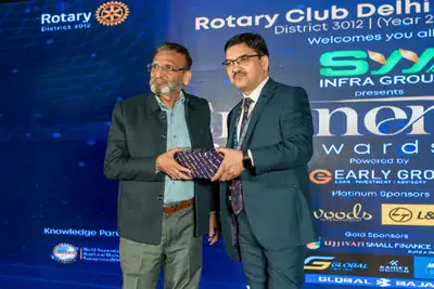 Eminence MSME Awards: Guest receiving a memento on stage