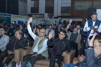 Eminence MSME Awards: Audience members raising their hands during a session