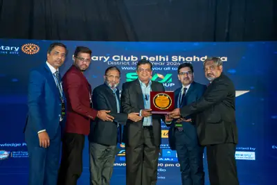 Eminence MSME Awards: Group presenting an award plaque on stage