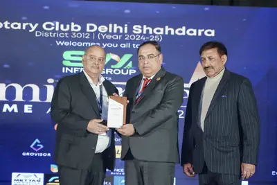 Eminence MSME Awards: Guest receiving a certificate on stage