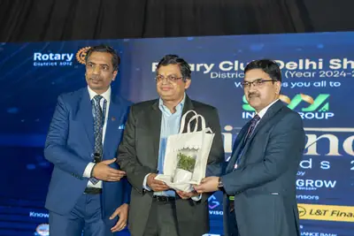 Eminence MSME Awards: Guest receiving a gift on stage