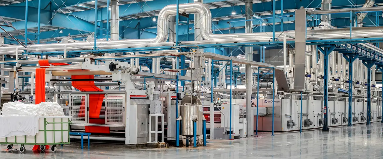 Industrial textile machinery on a factory floor