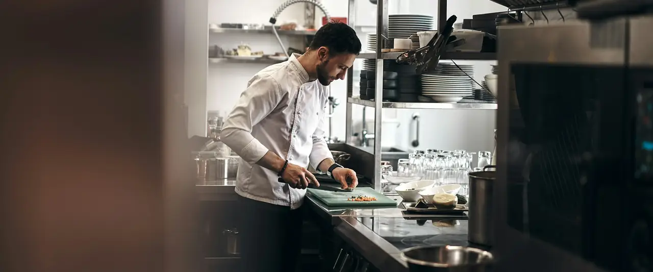 Chef preparing food in a commercial kitchen