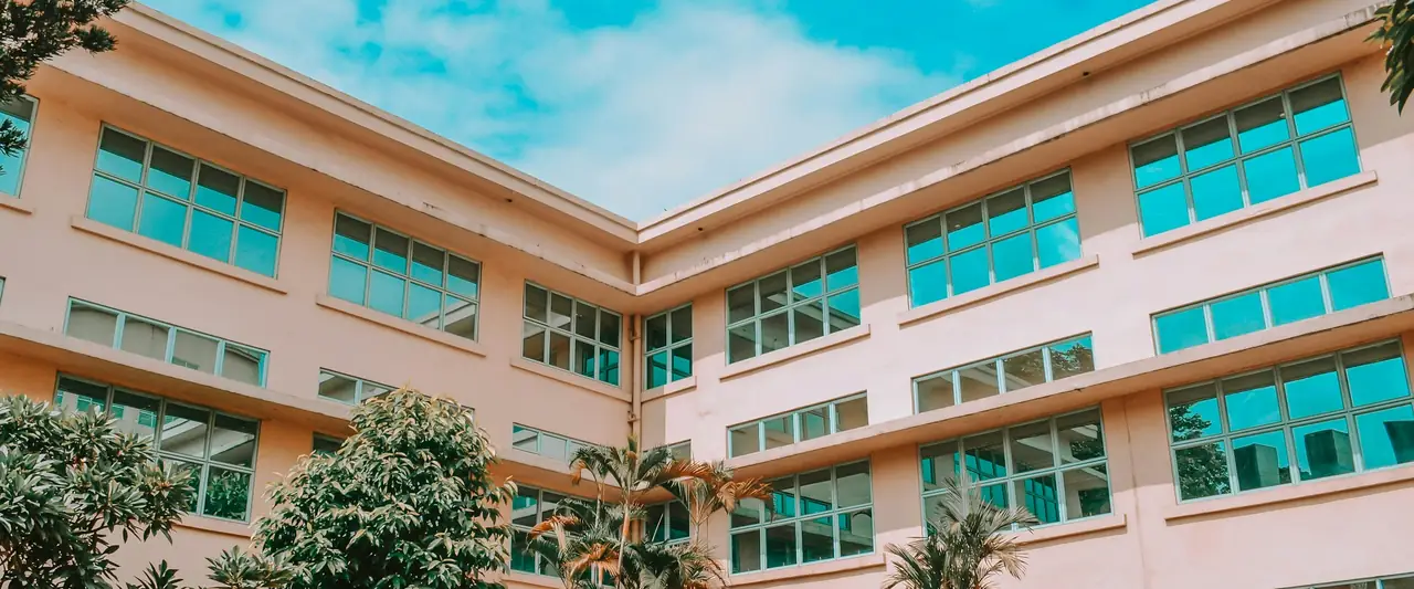 Institutional campus building with trees