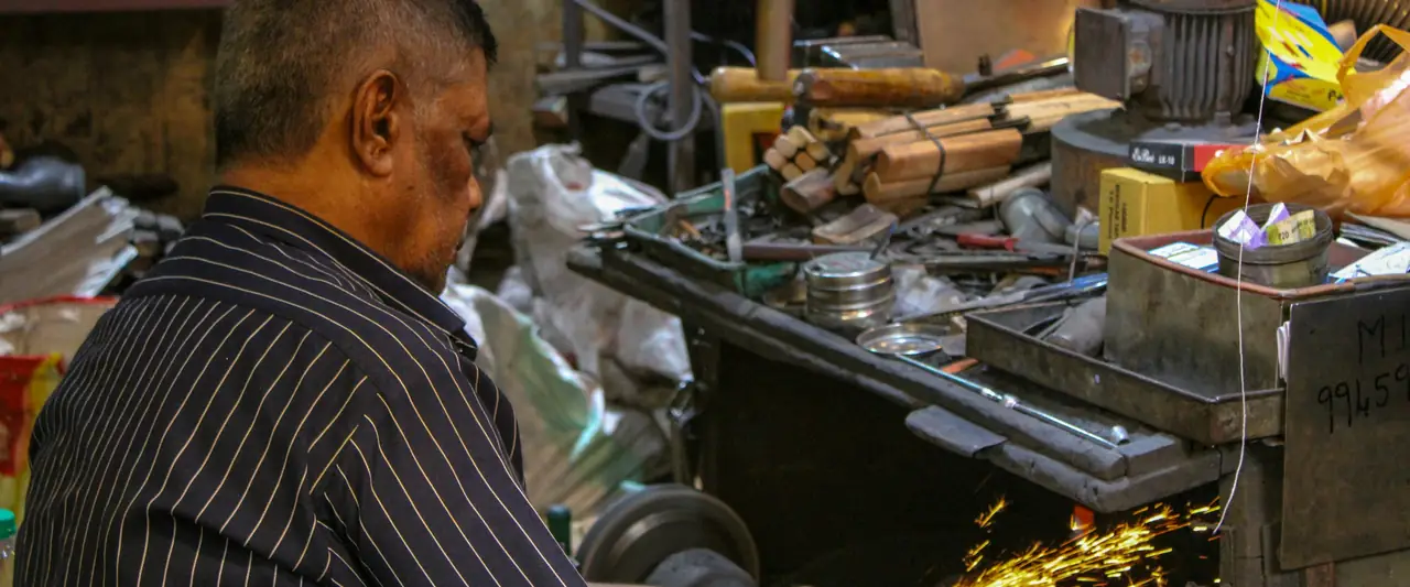 Machinist working in a small manufacturing workshop
