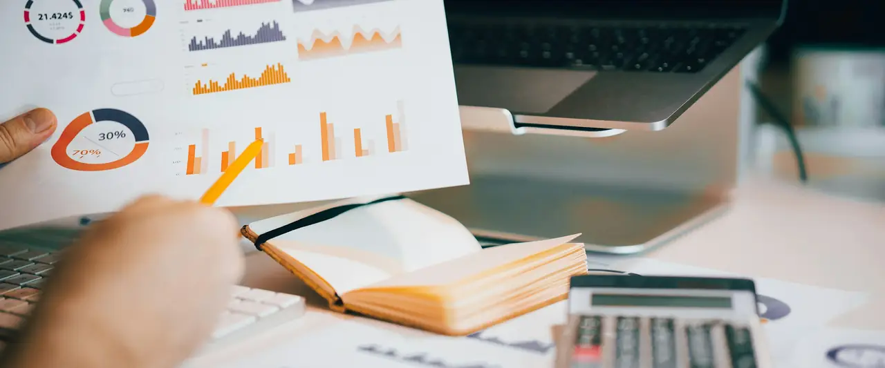 Reviewing a receivables report with a calculator